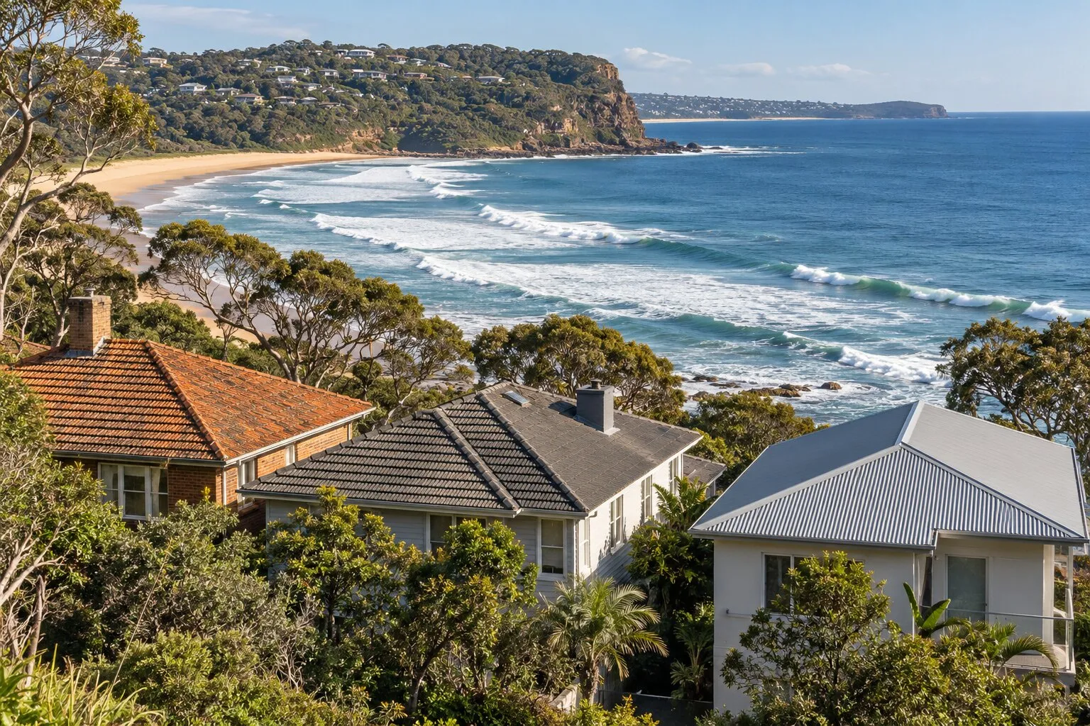Terracotta, concrete and metal roofs, Northern Beaches: three neighbouring beach houses, one with each roof, above a surf beach